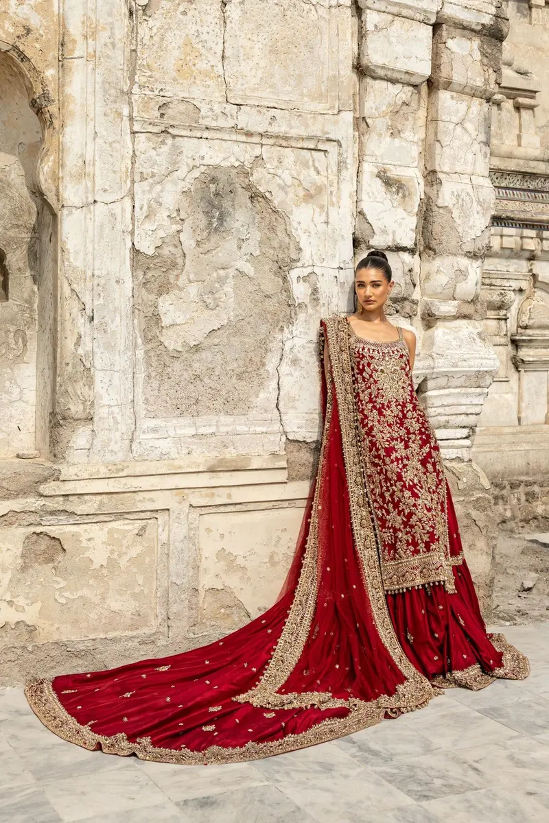 Aneesa in crimson hand-worked couture.